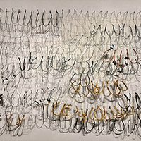 Valerie Mann - <em>Letter to My Daughter</em> Wire, rubber, leather,
 found objects 40" x 51" x 6" 2019 $3,000
