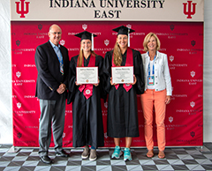 Four individuals standing in front of the IU East media backdrop include Steve Simon, Shelby Rogers, Nicole Melichar and Lisa Gratta